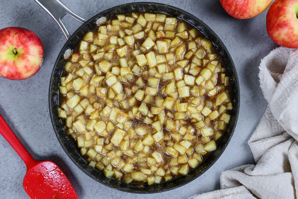 image of apple cake filling being cooked down in a large skillet