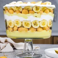 image of banana pudding trifle that's been layered in an 8 inch trifle dish