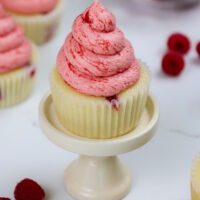 image of raspberry cupcakes made with vanilla cupcakes and raspberry buttercream