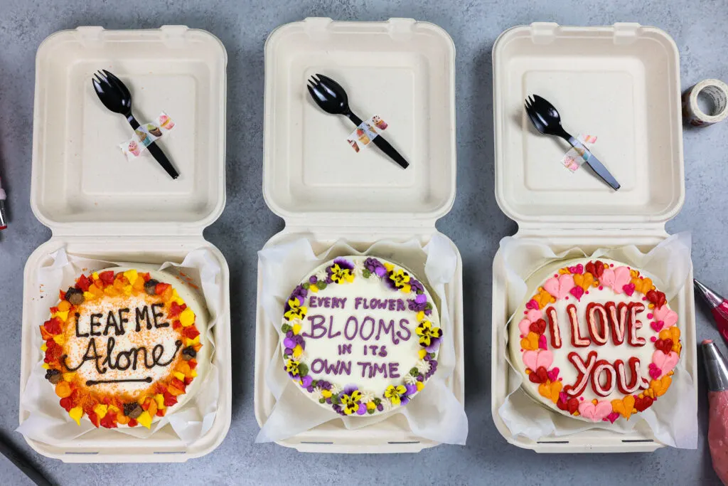image of three lunch box cakes that are ready to be delivered