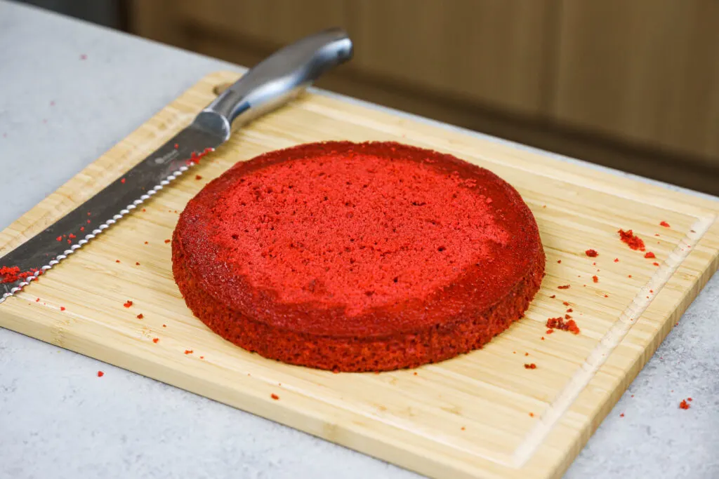 image of an 8 inch red velvet cake layer that's been leveled with a serrated knife