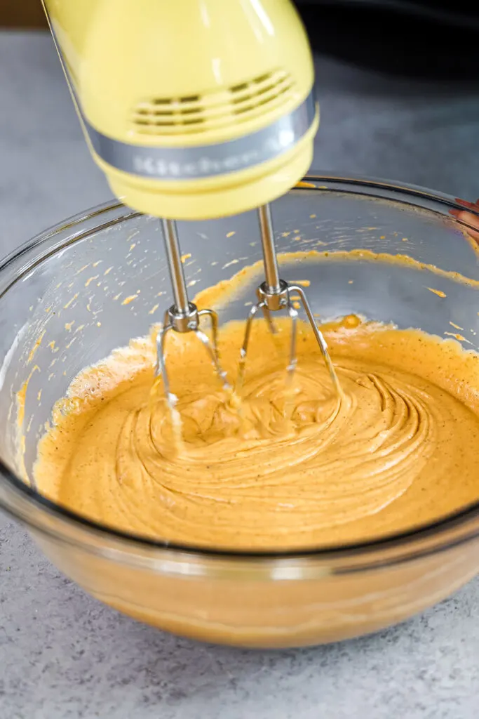image of pumpkin cheesecake batter being mixed together