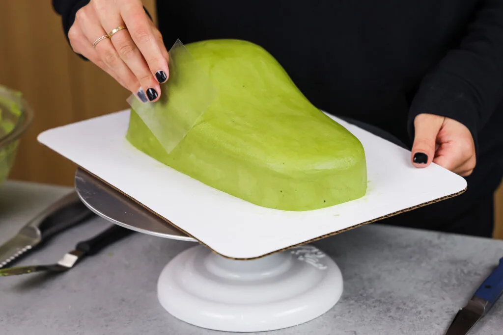 image of green buttercream frosting being smoothed
