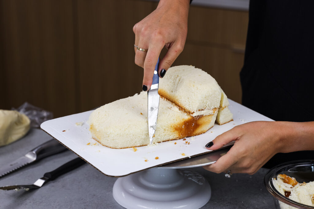 image of cake layers being cut to make a crocodile cake