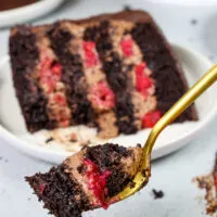 image of a bite of chocolate raspberry mousse cake on a fork