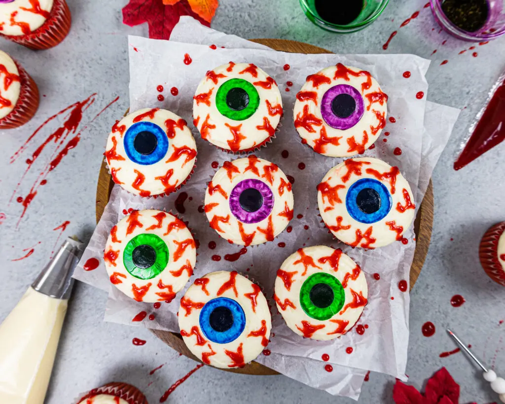 image of halloween eyeball cupcakes made with edible blood veins and red velvet cupcakes