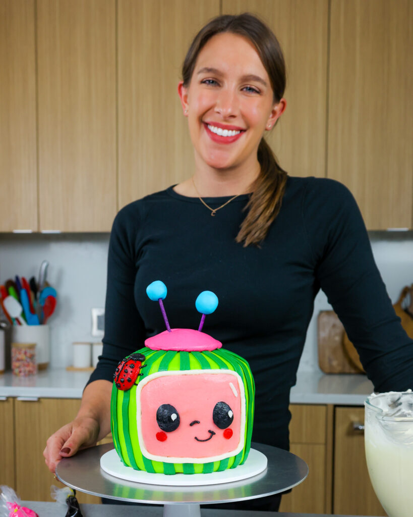 image of chelsey white of chelsweets with an adorable cocomelon cake she made using buttercream and no fondant