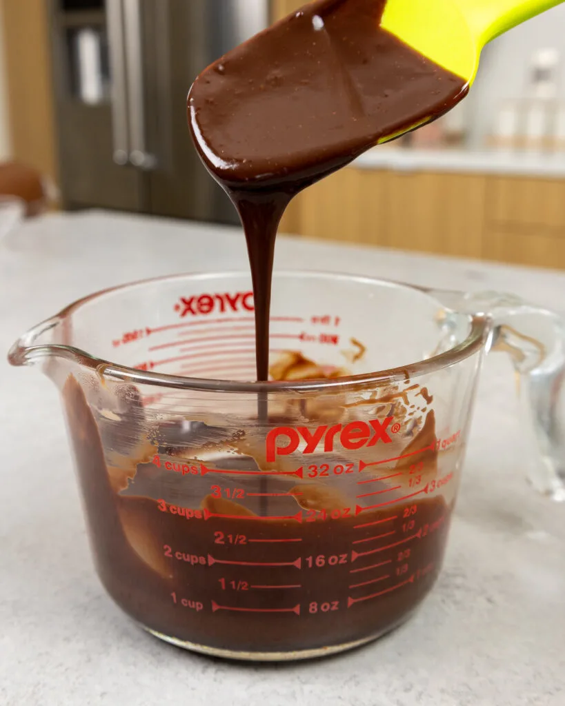 image of milk chocolate ganache that's been made to add a chocolate drip to a milky way cake