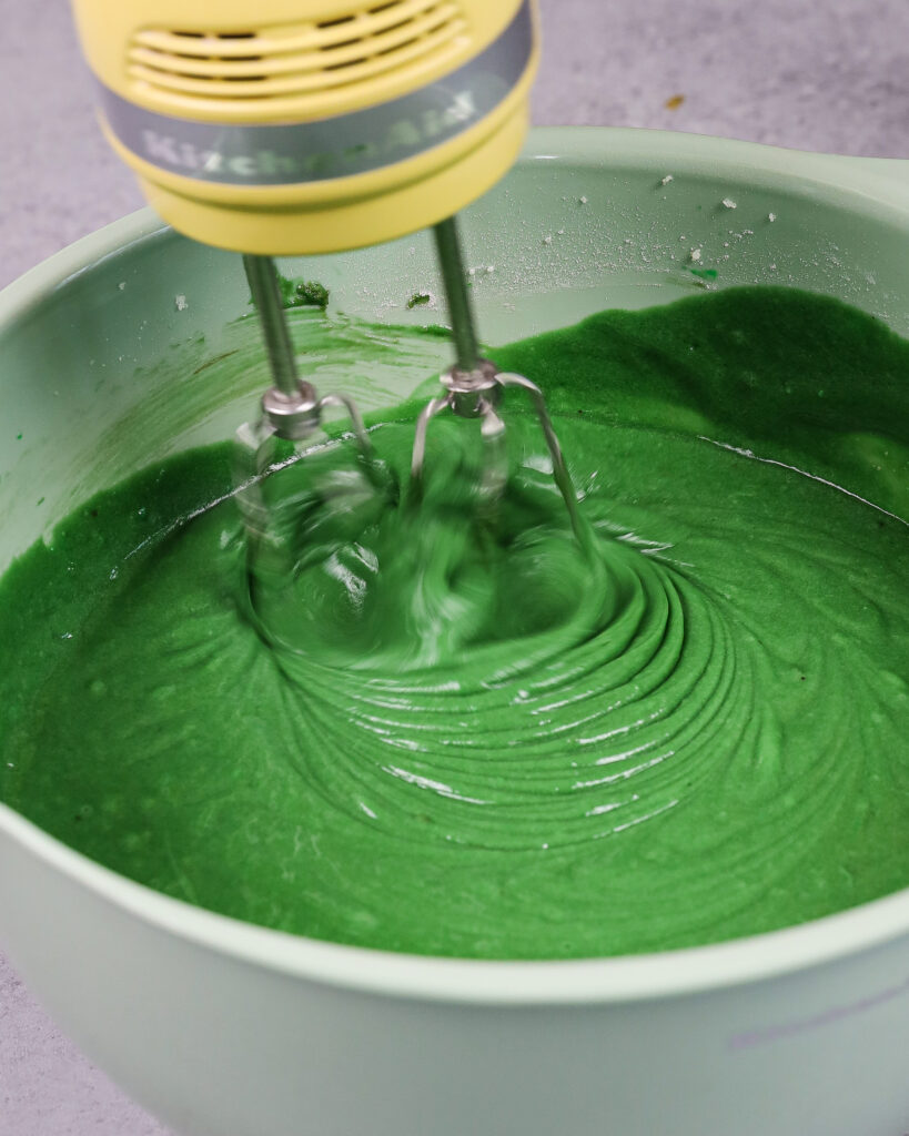 image of green velvet cake batter being mixed