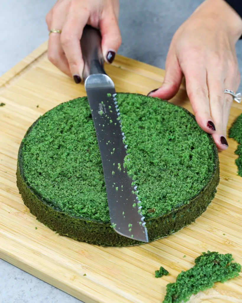 image of a green velvet cake layer being leveled