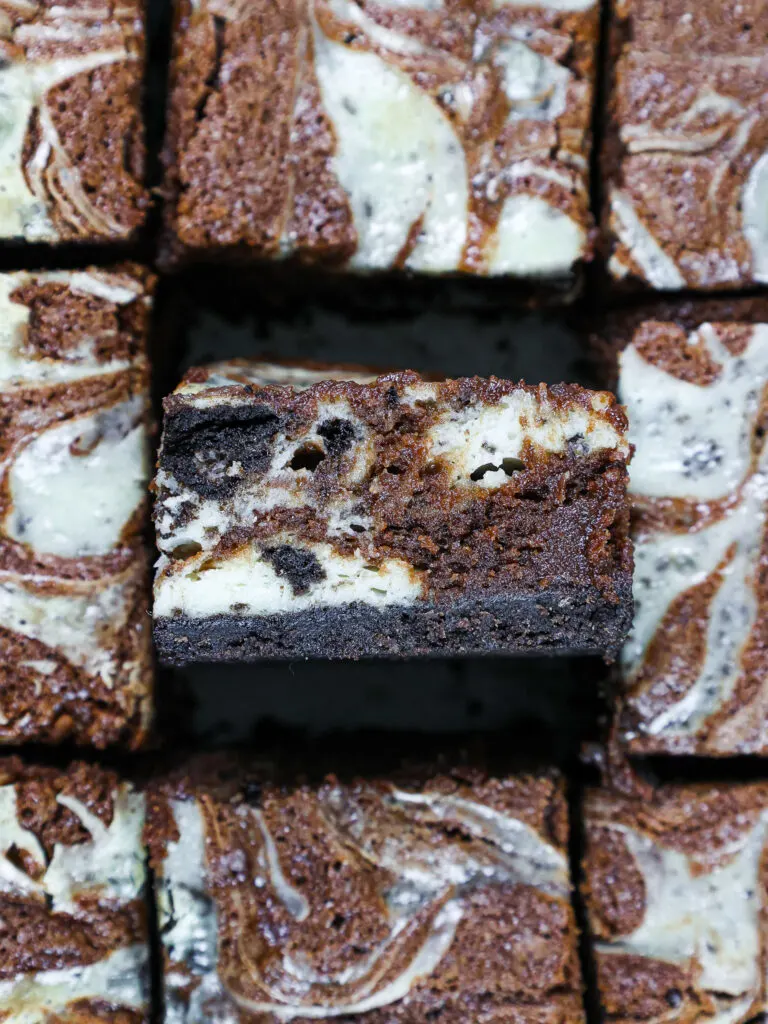 image of oreo cheesecake brownies that have been chilled and cut