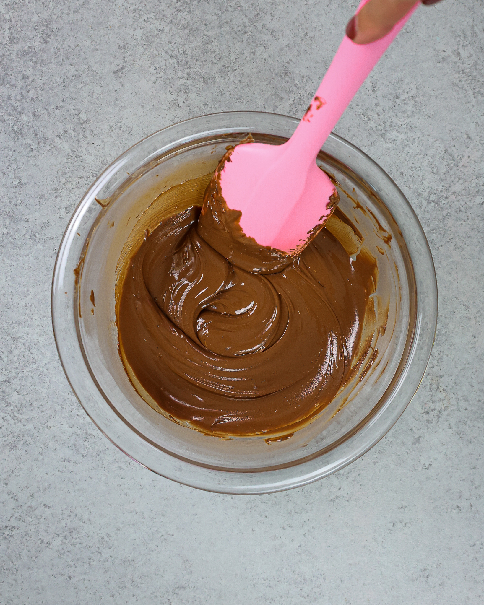 image of water, cocoa powder, and dark chocolate whisked together