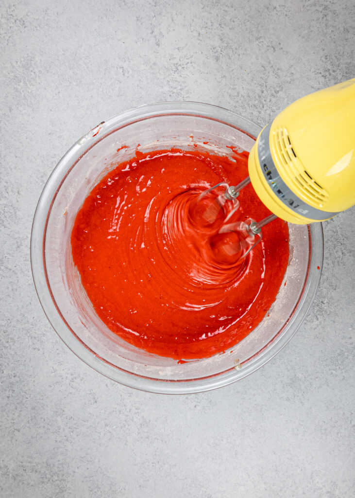 image of red velvet cupcake batter being mixed together