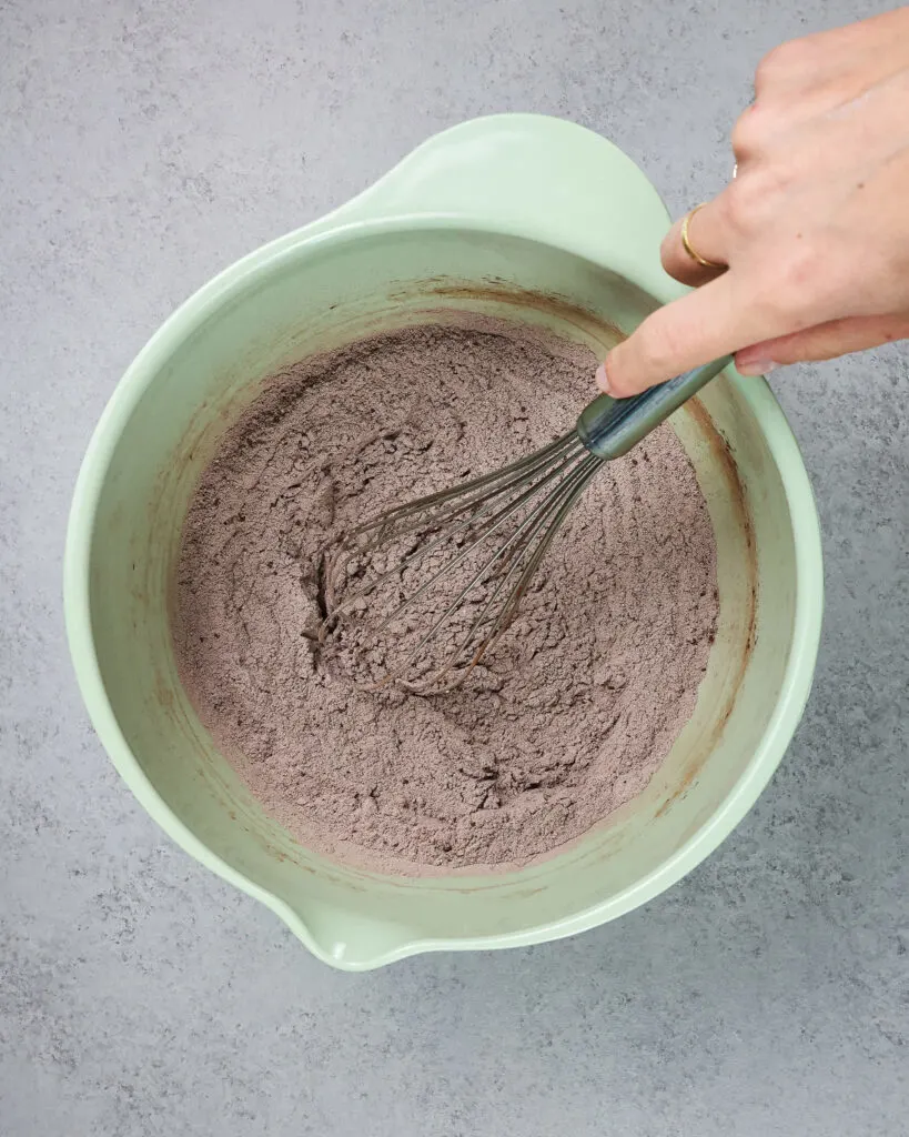 image of dry ingredients being mixed together to make chocolate cookie batter