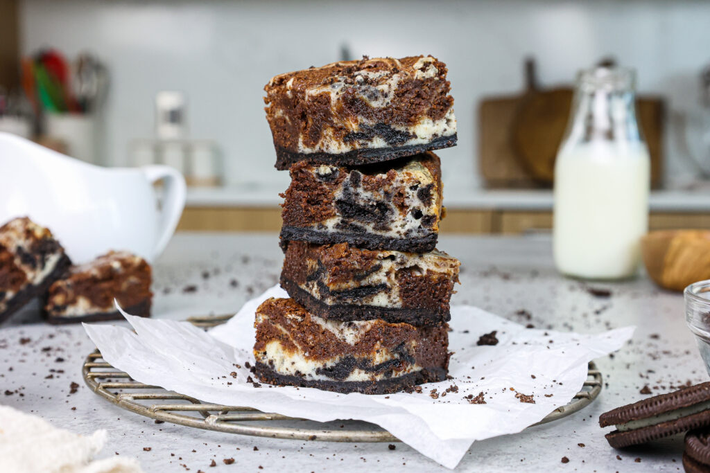 image of oreo cheesecake brownies stacked on top of each other