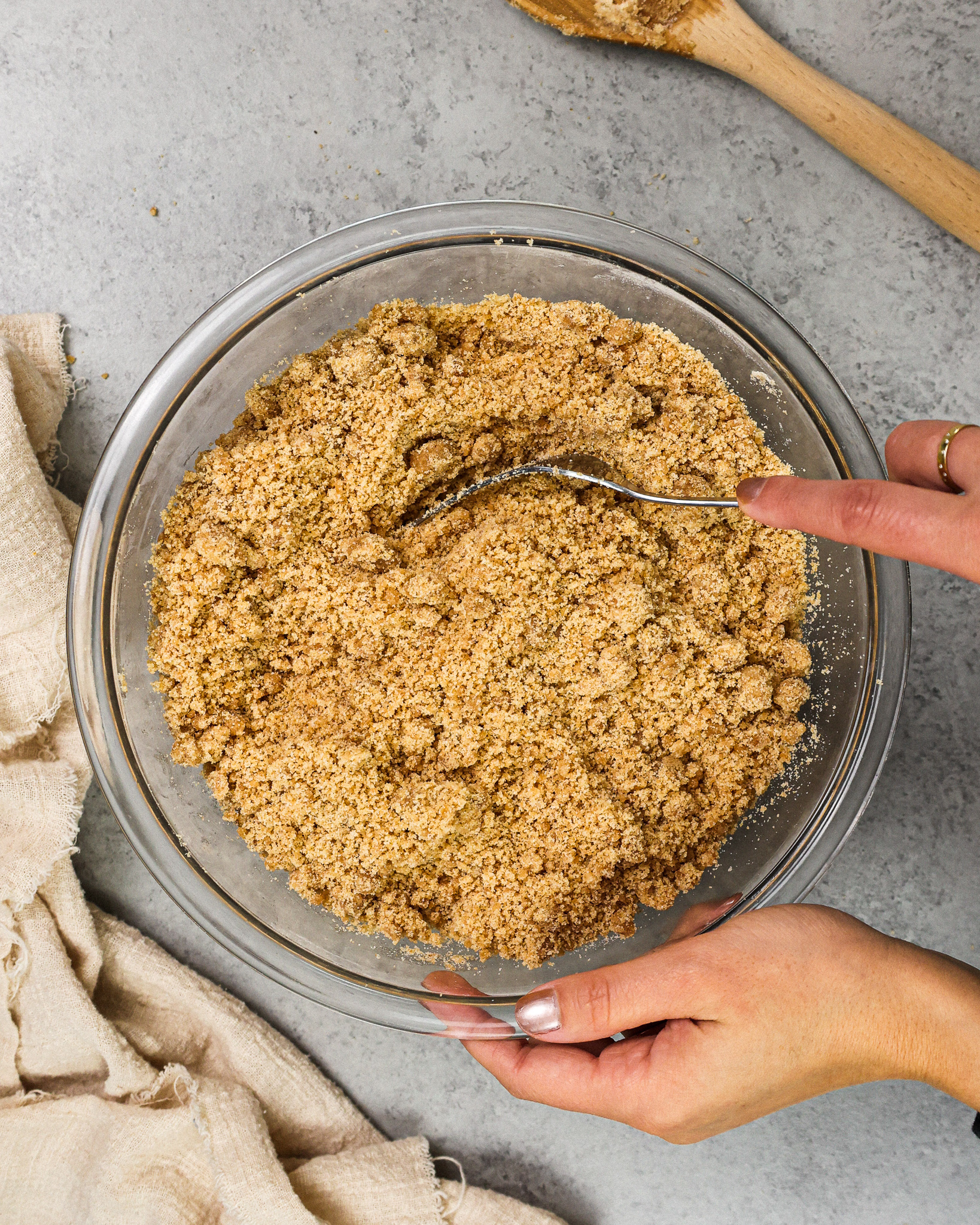 image of cinnamon streusel topping being made with a fork