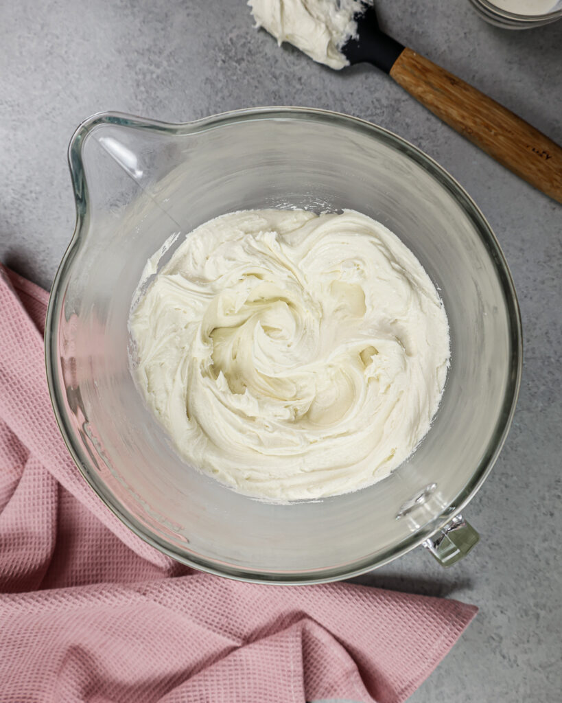 https://chelsweets.com/wp-content/uploads/2021/11/overhead-shot-of-vanilla-buttercream-frosting-in-mixing-bowl-819x1024.jpg