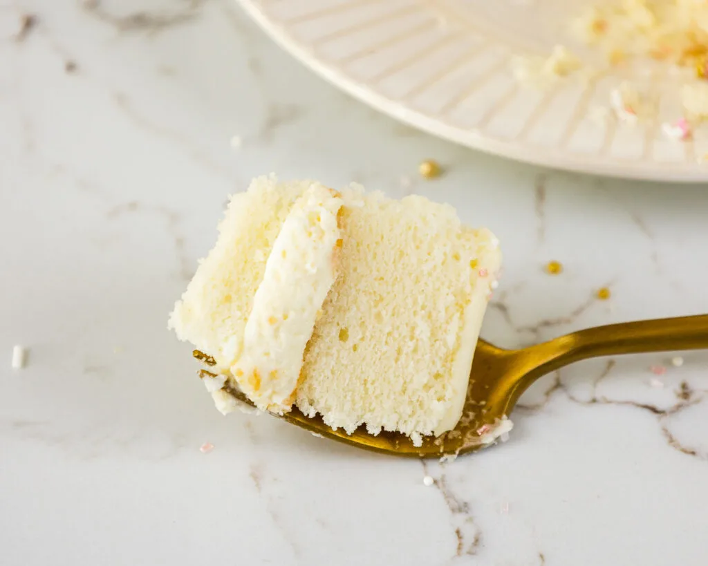 image of a bit of a white chocolate mousse cake on a fork