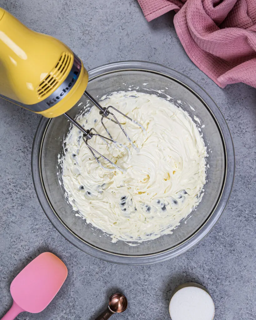 image of cream cheese being whipped up until smooth to make no bake cheesecake bites