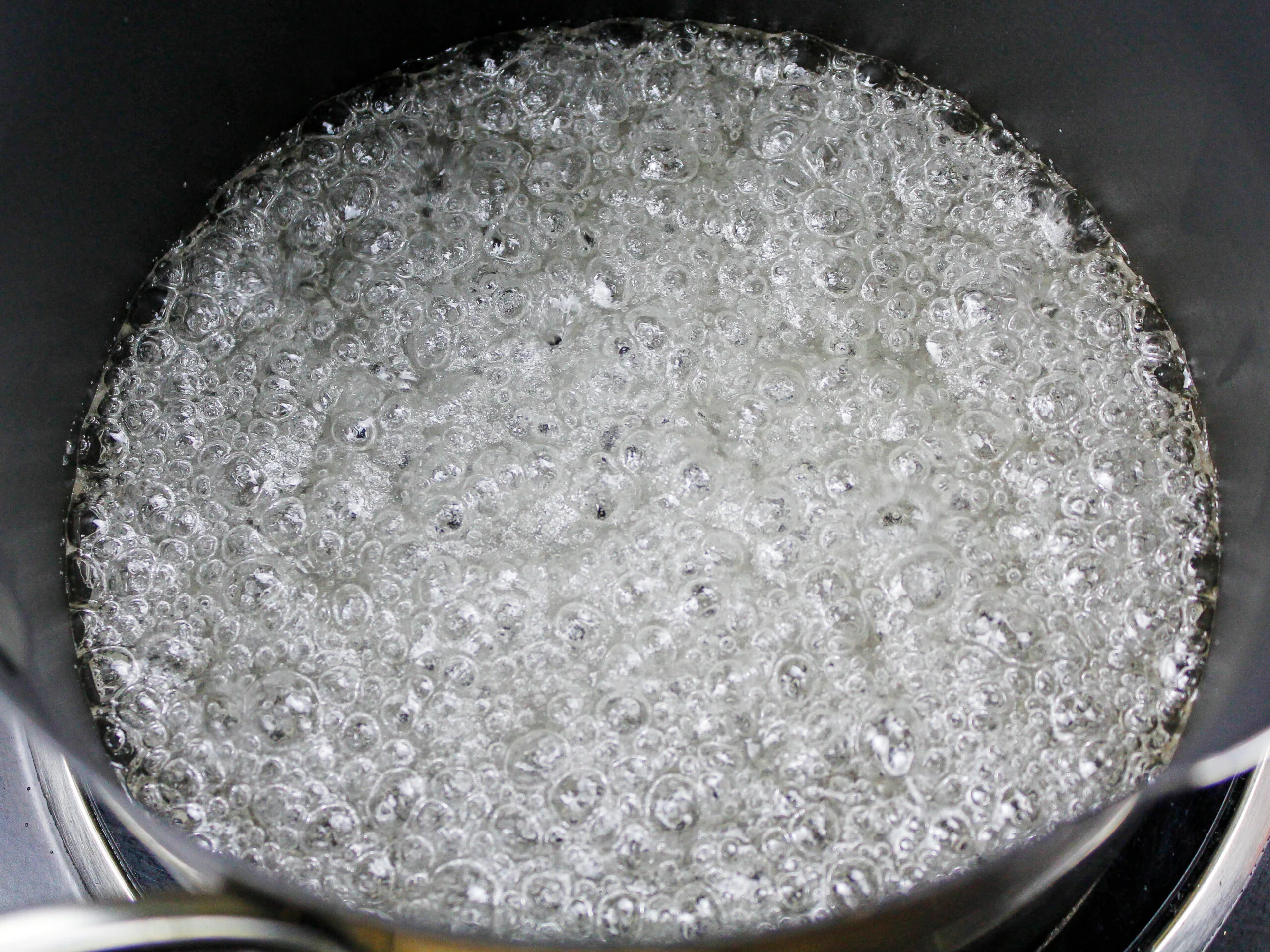 image of sugar and water being boiled to make sugar shards or sugar glass