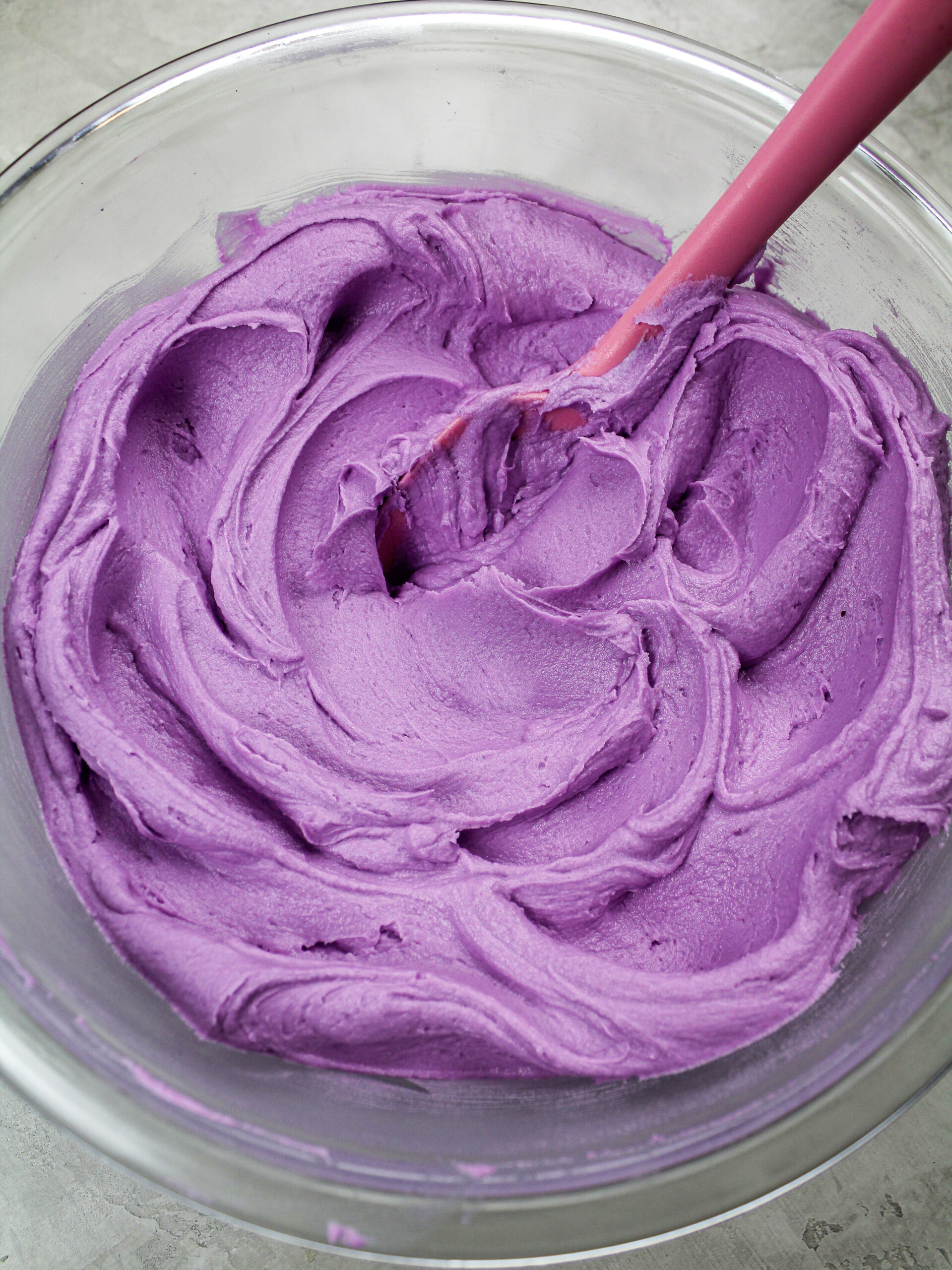 image of beautiful purple frosting colored with americolor gel food coloring to make a buttercream rosette cake