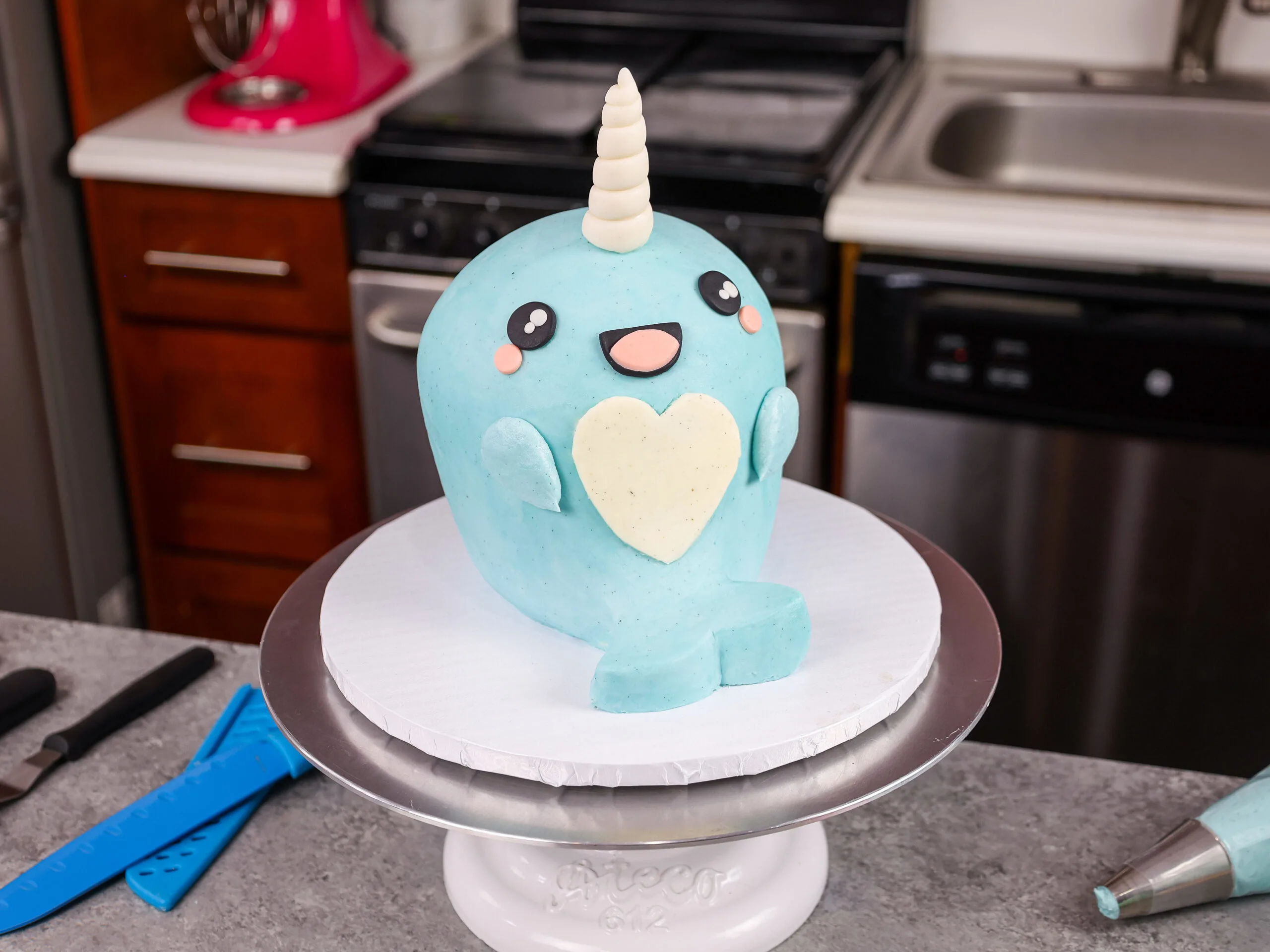 image of an adorable narwhal cake made with buttercream