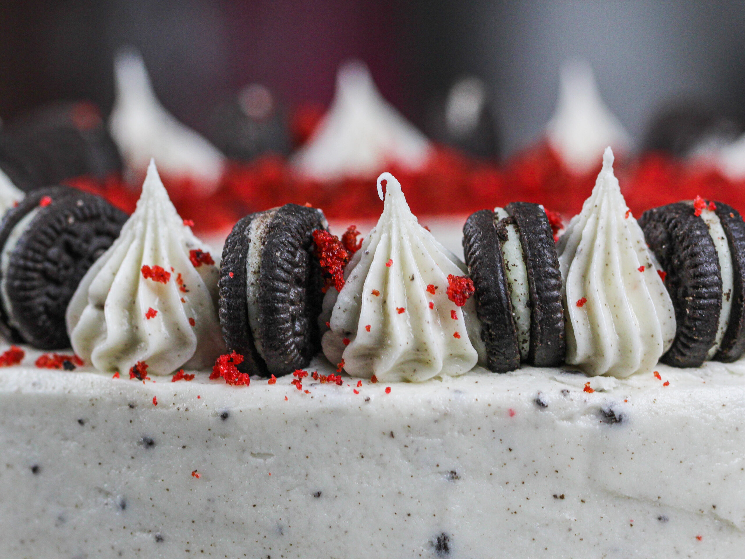 image of oreo cream cheese frosting piped on top of a cake