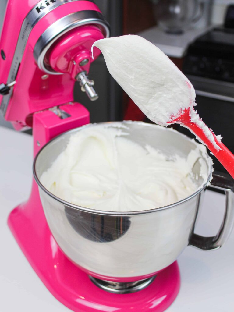 image of buttercream frosting being tested for the right consistency