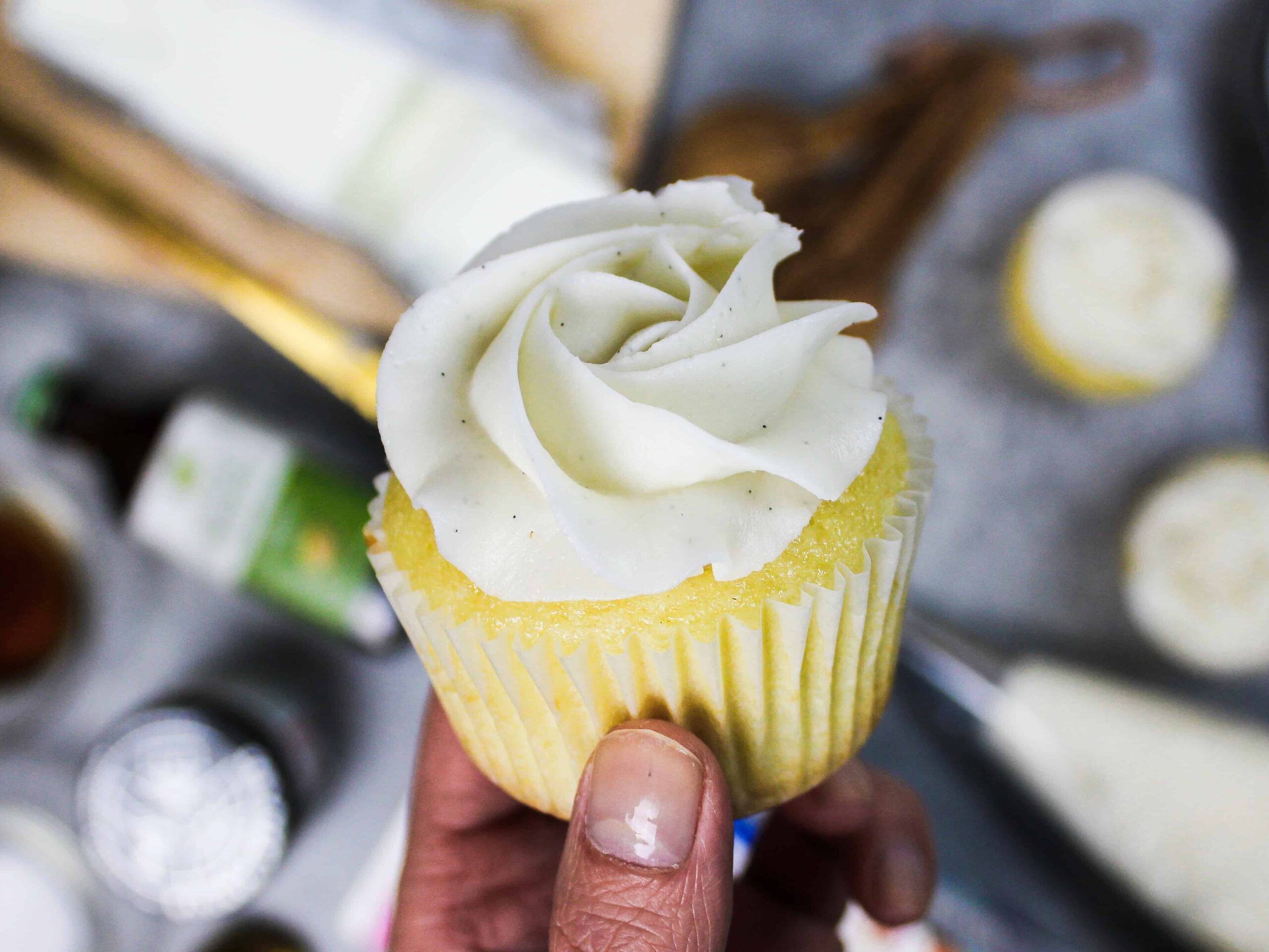 image of vanilla bean buttercream frosting piped onto a cupcake