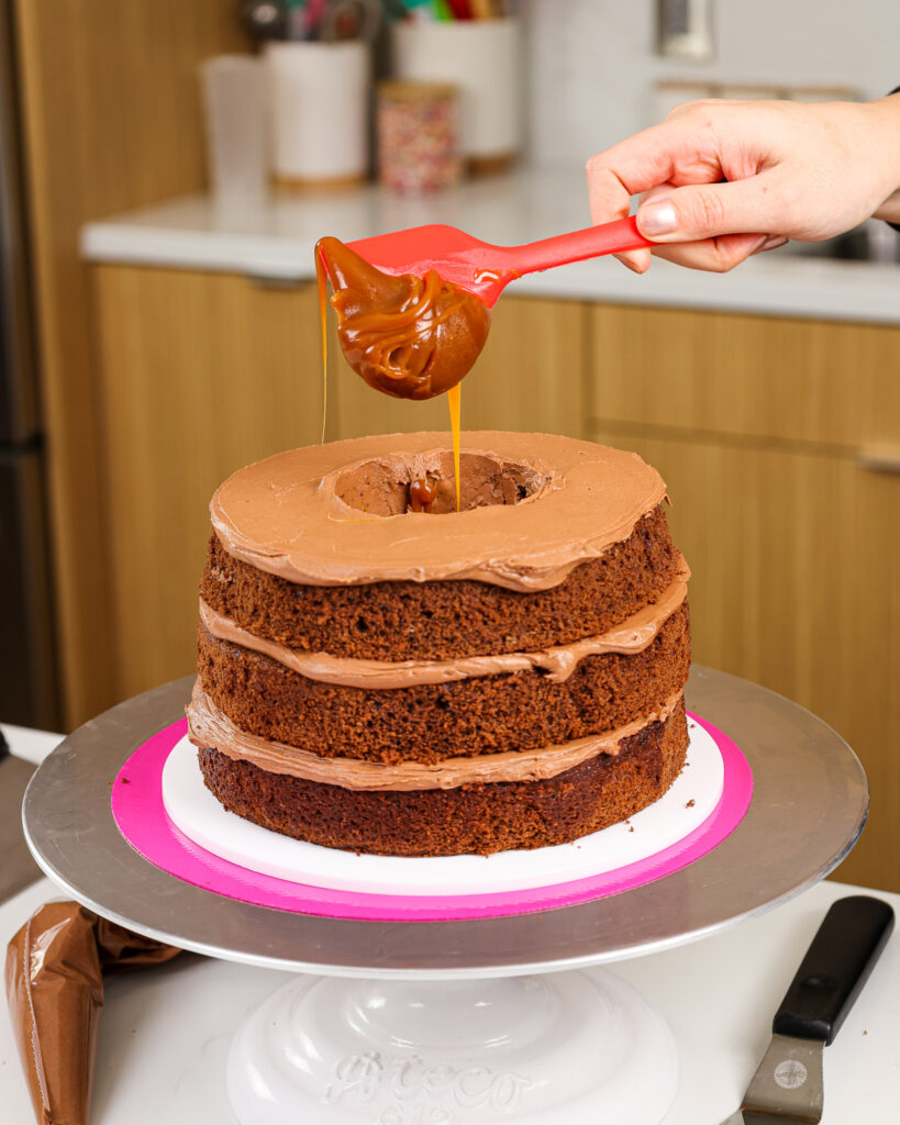 image of a rolo cake being filled with caramel