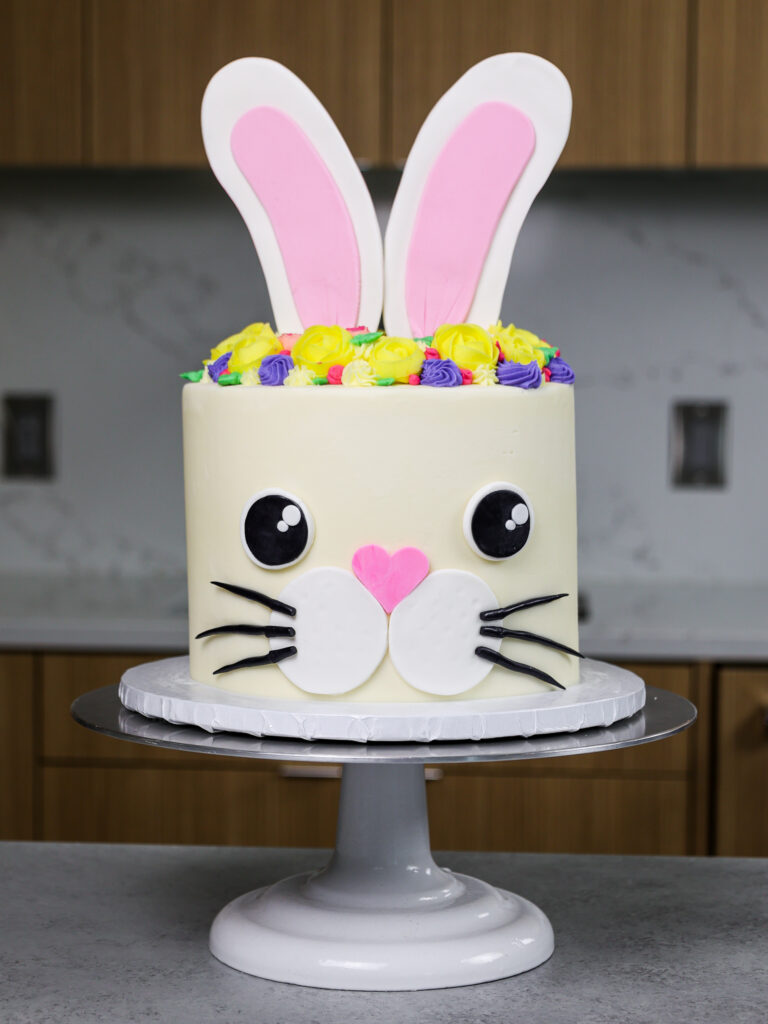 image of a bunny birthday cake made with funfetti cake layers and homemade vanilla buttercream