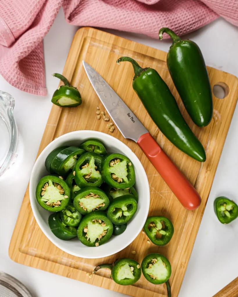 image of sliced up jalapenos that are ready to make jalapeno simple syrup for a spicy frozen mango margaritas