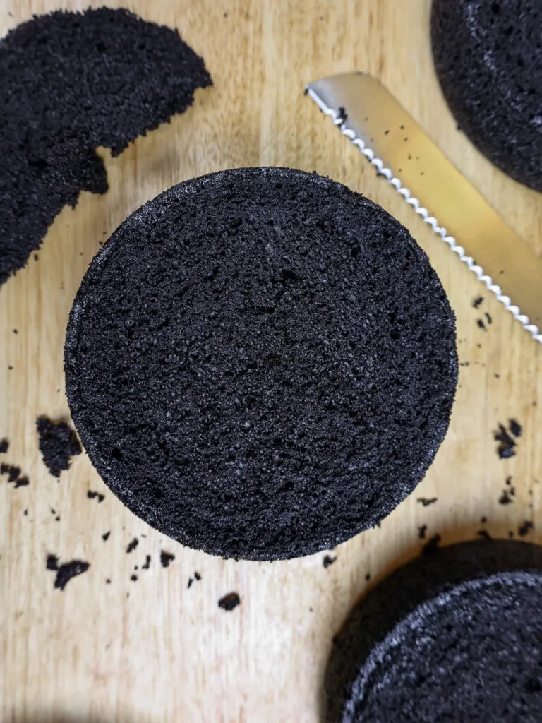 image of moist black cocoa cake layers that have been leveled with a serrated knife