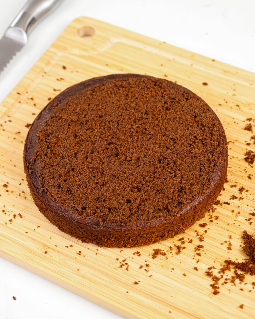image of a soft and tender chocolate cake layer that's been leveled with a serrated knife