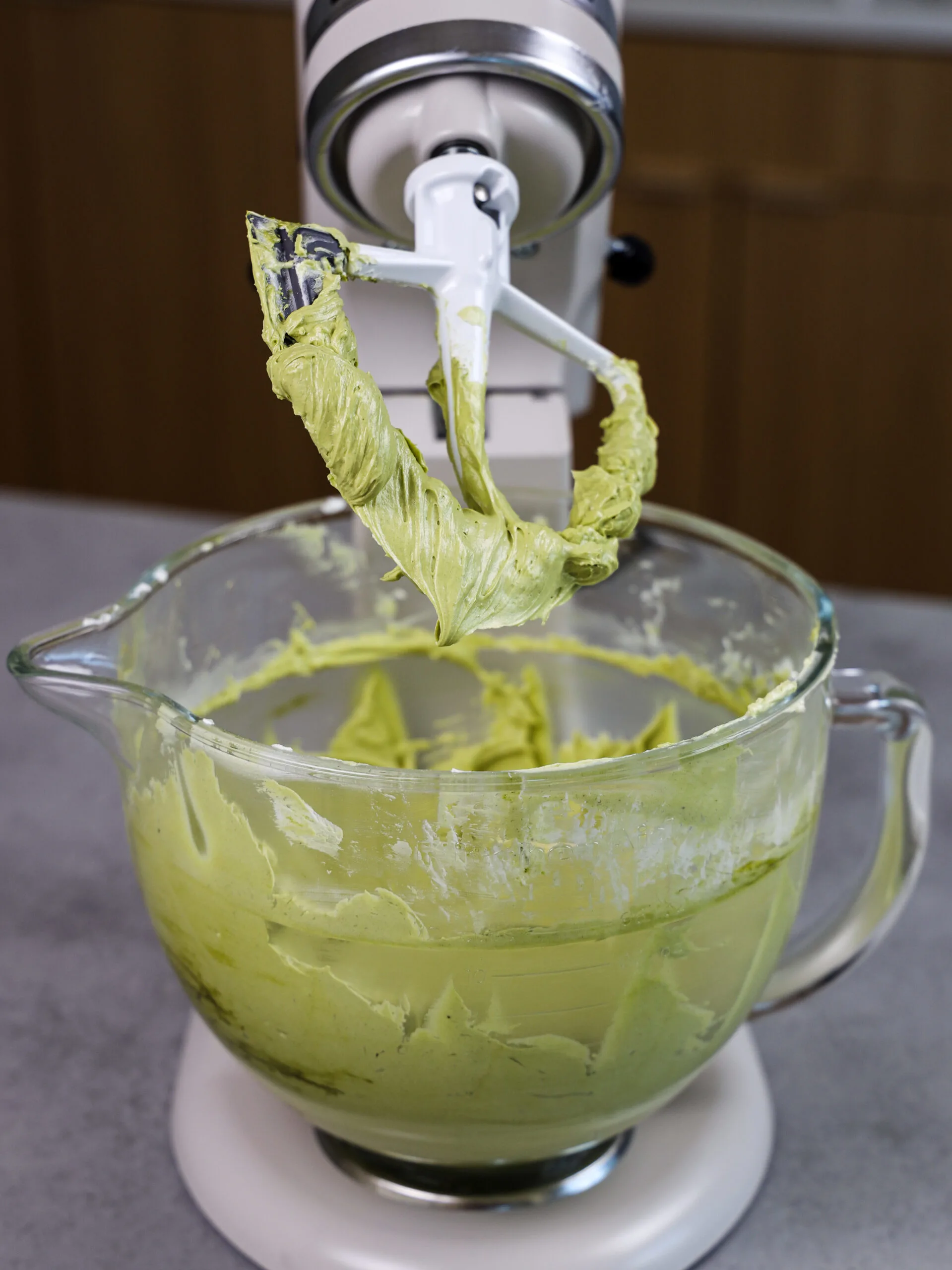 image of matcha buttercream that's been mixed with a paddle attachment at the end of the process to make it super smooth