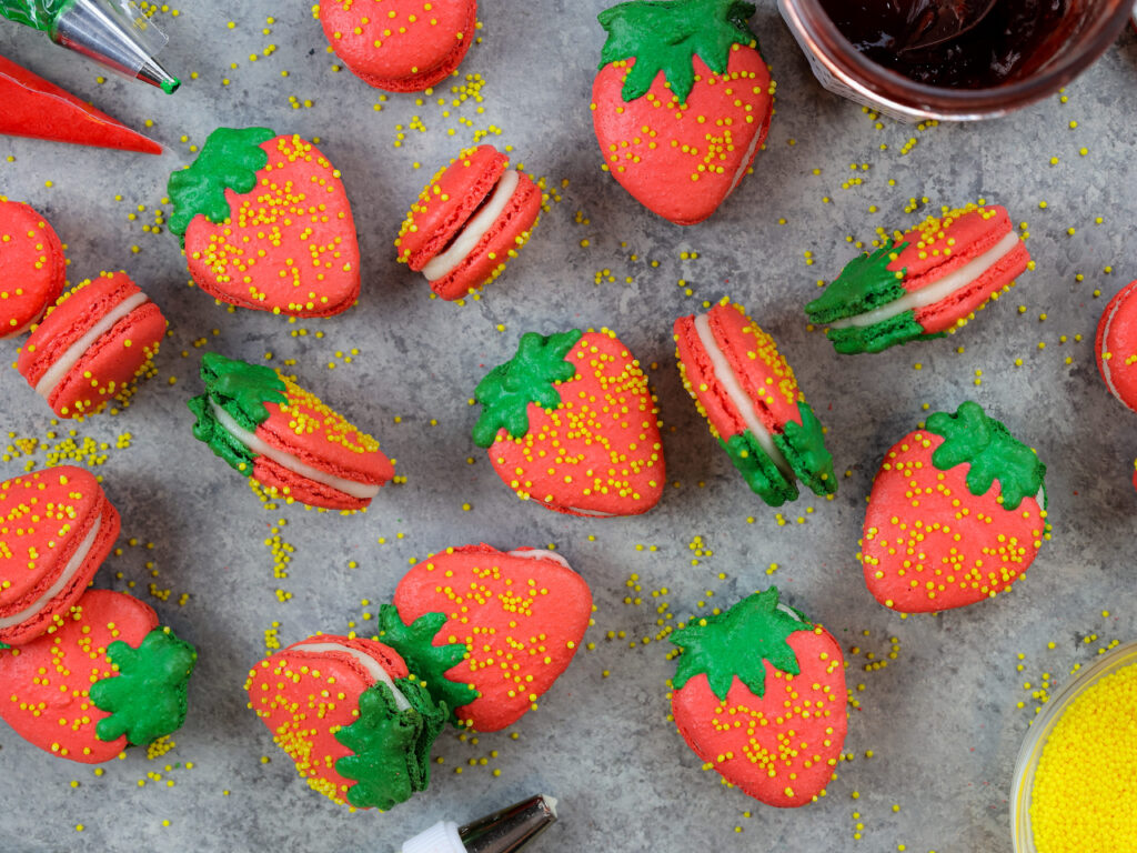 image of adorable french strawberry macarons filled with buttercream and strawberry jam
