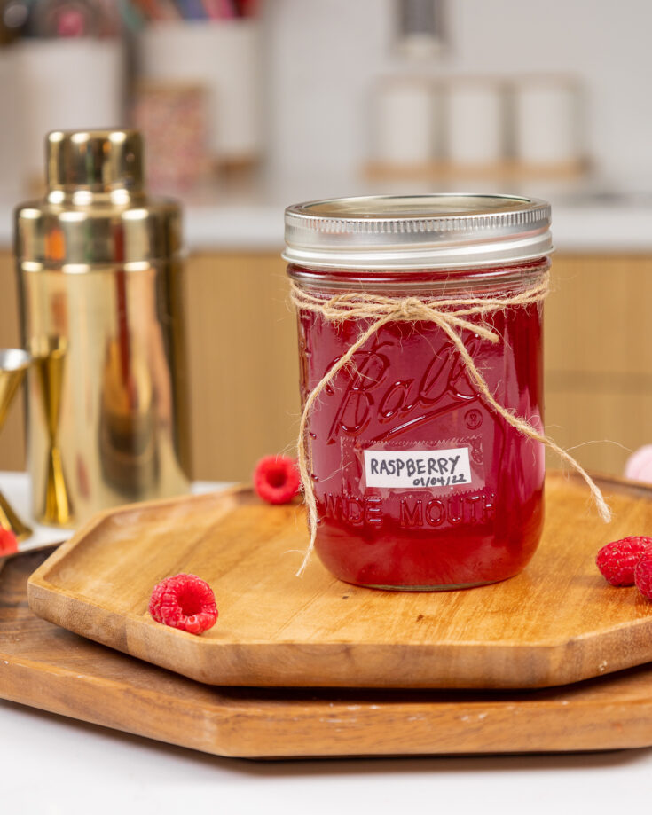 image of raspberry simple syrup in a mason jar