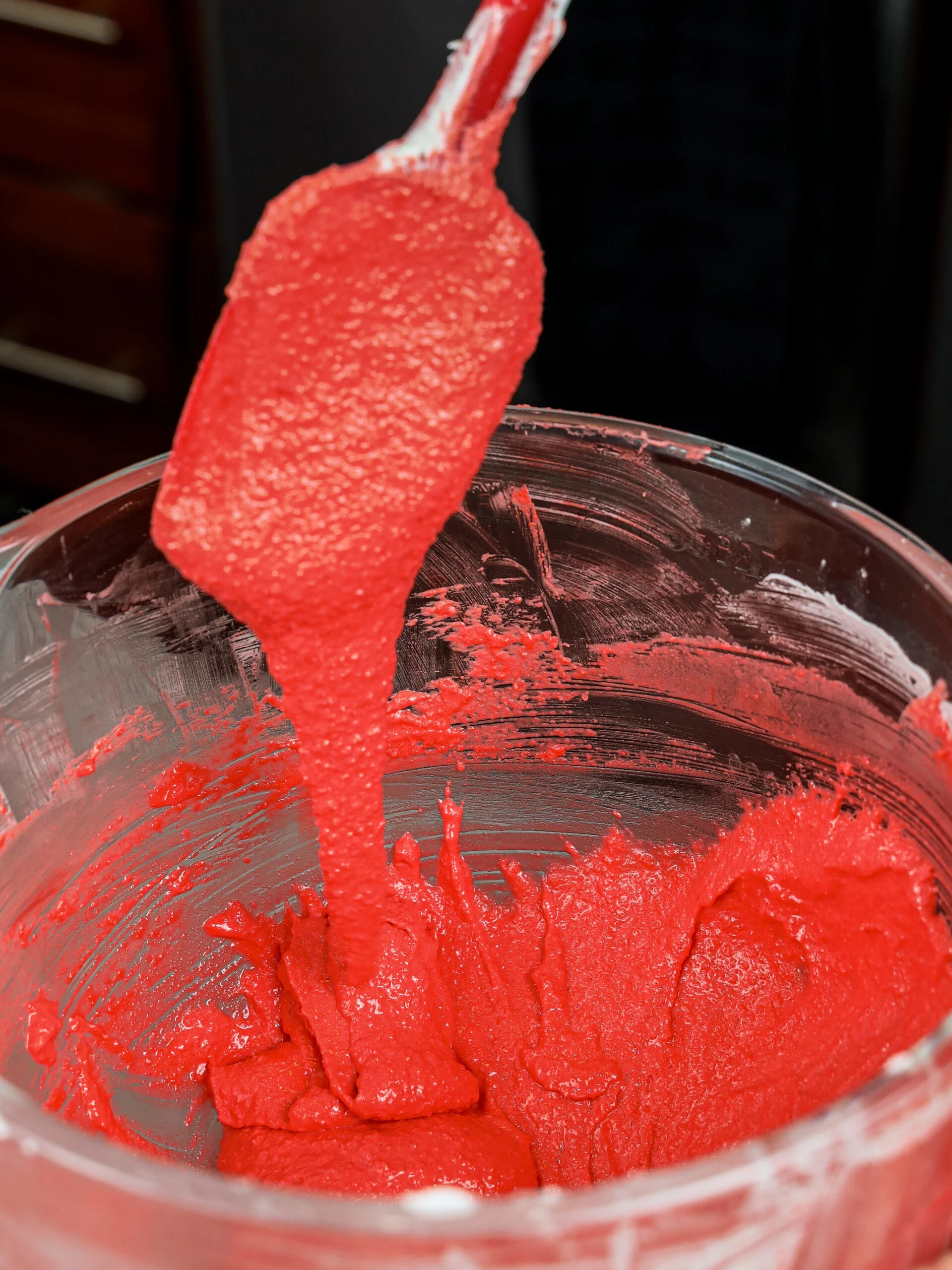 image of red french macaron batter being made for strawberry macarons