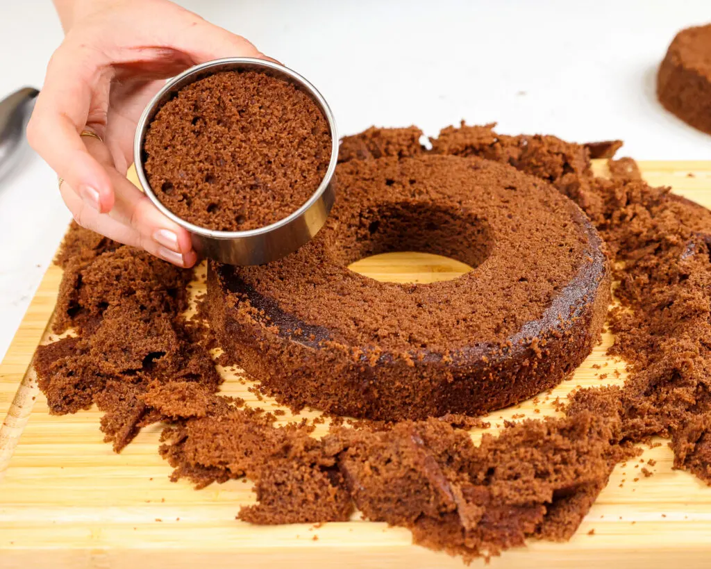 image of a chocolate cake layer that's had it's center removed with a circle cutter