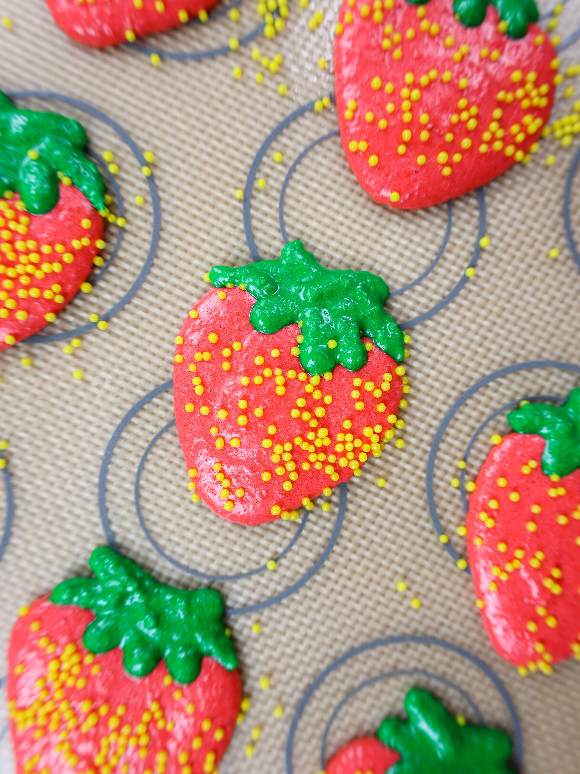 image of strawberry shaped macaron shells resting before being baked