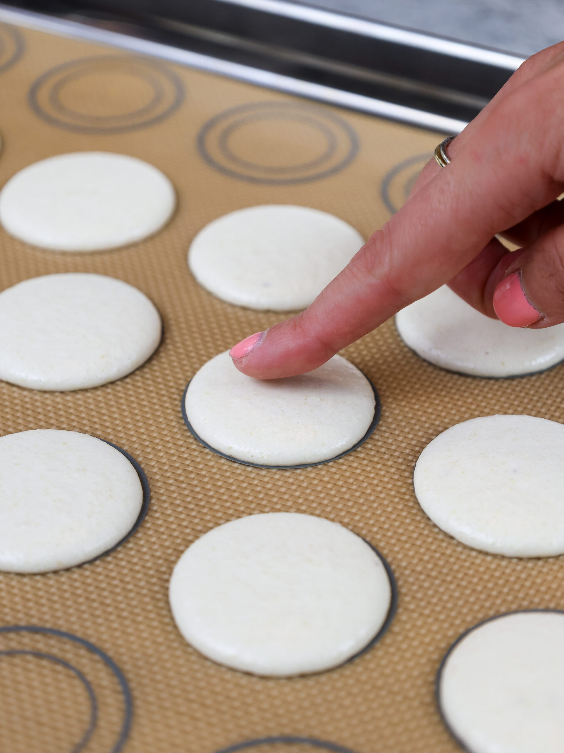 image of vanilla macaron shells that have rested and formed a skin and look matte