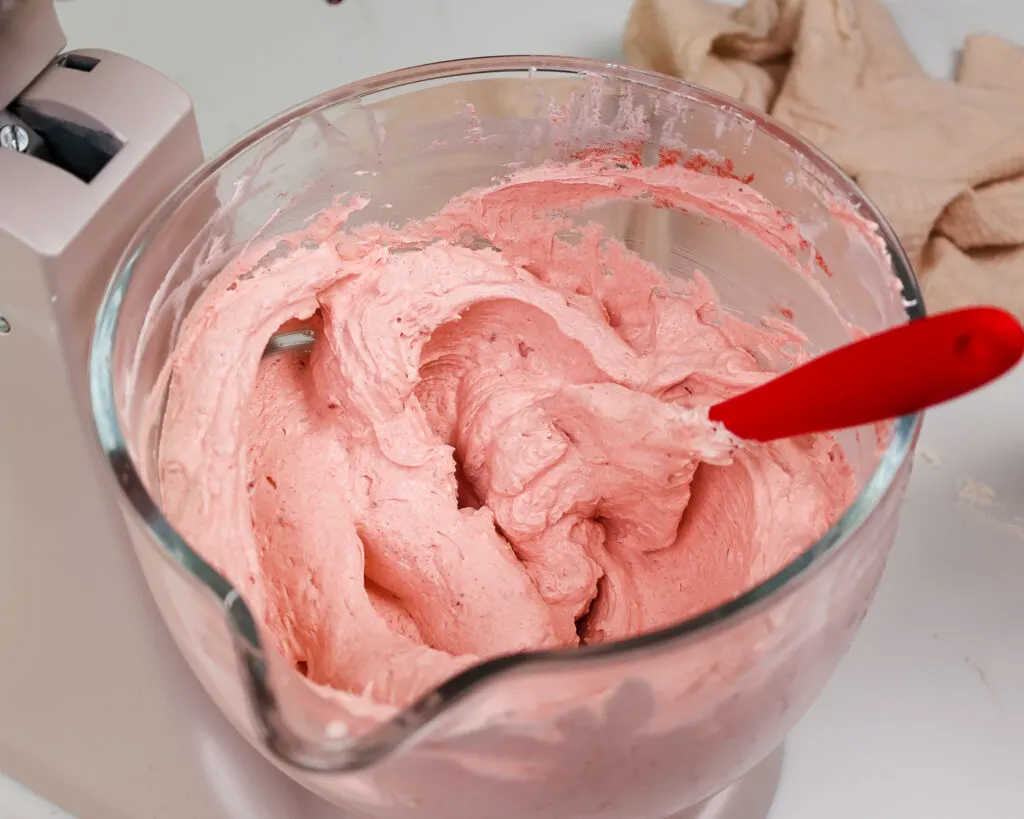 image of strawberry swiss meringue buttercream that's mixed and ready to be used