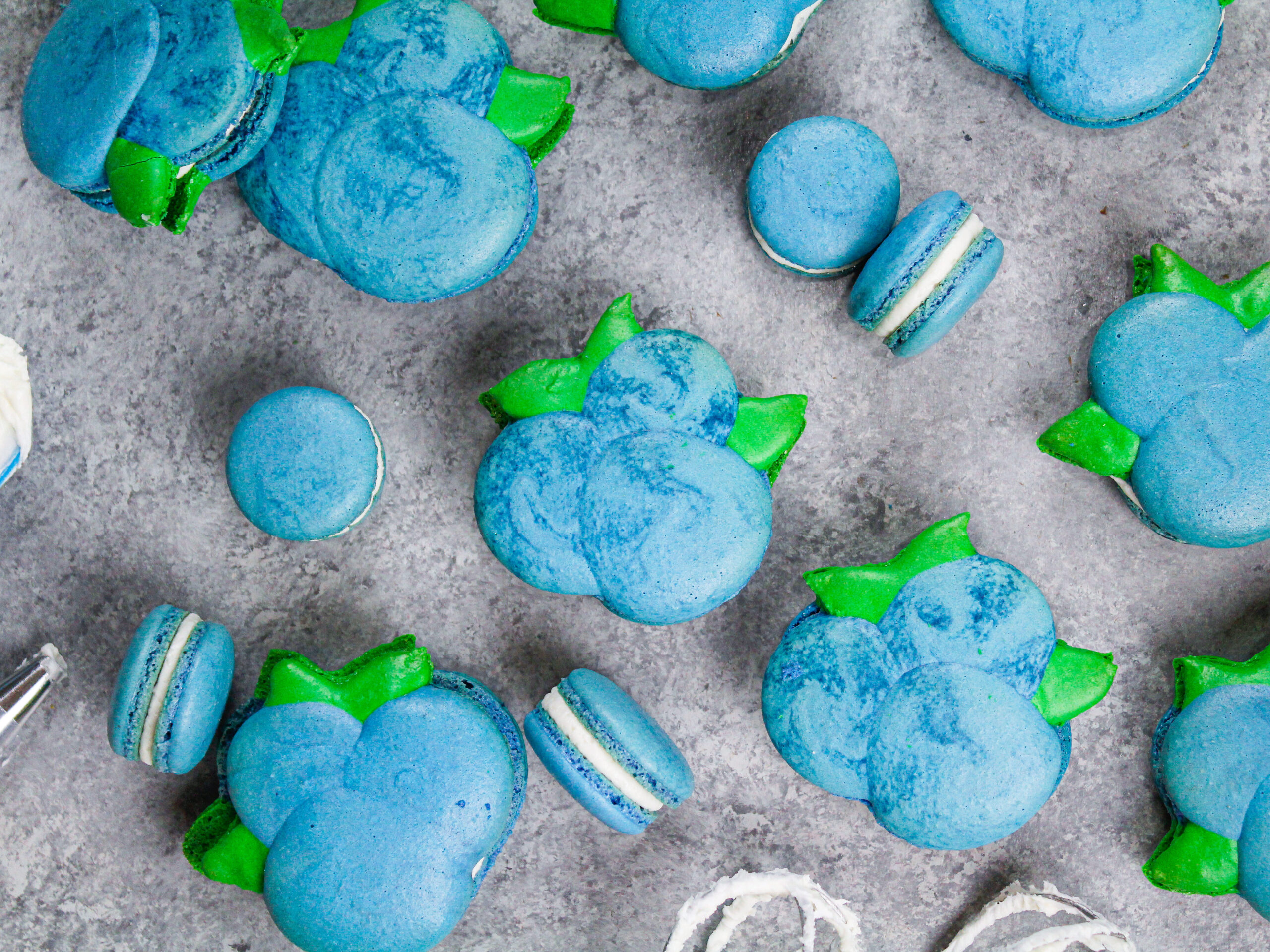 image of blueberry shaped macarons baked and filled with buttercream and blueberry jam