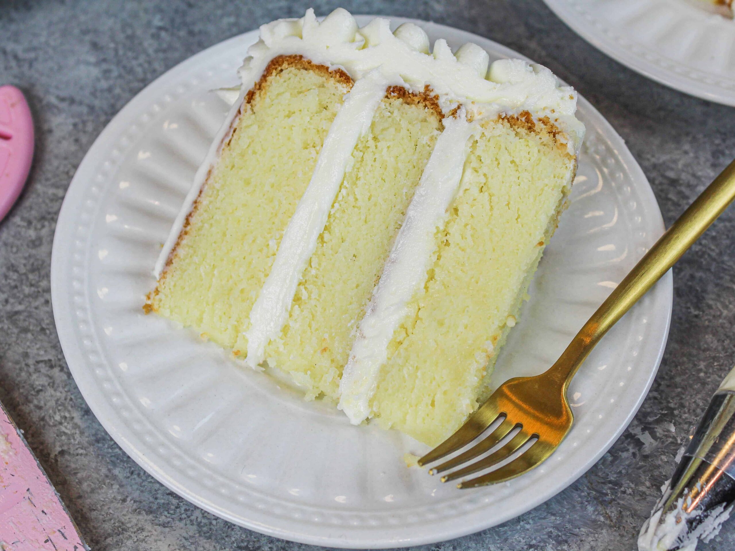 image of gluten free vanilla cake slice on plate
