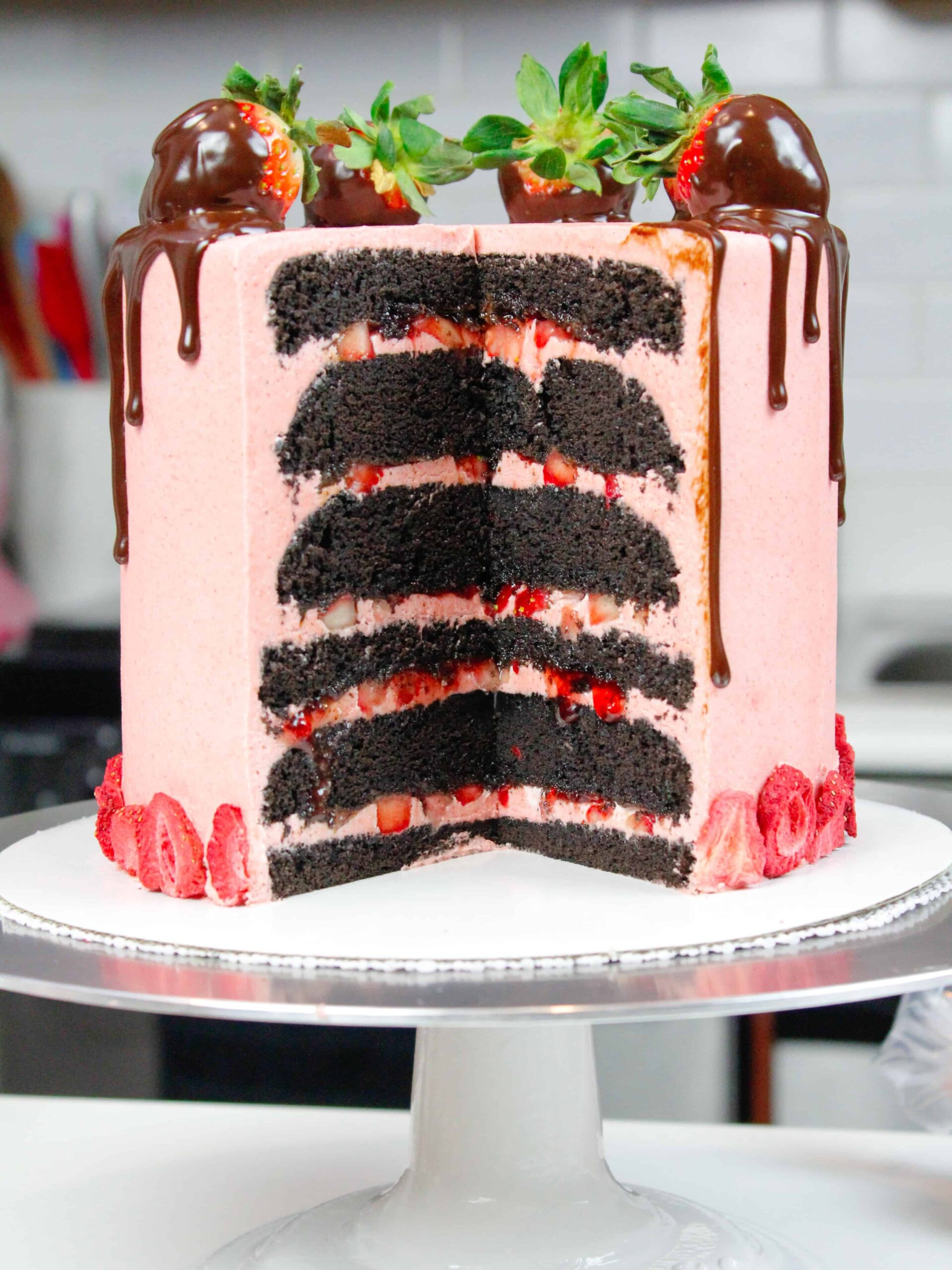 image of chocolate cake with strawberry buttercream and fresh strawberry filling