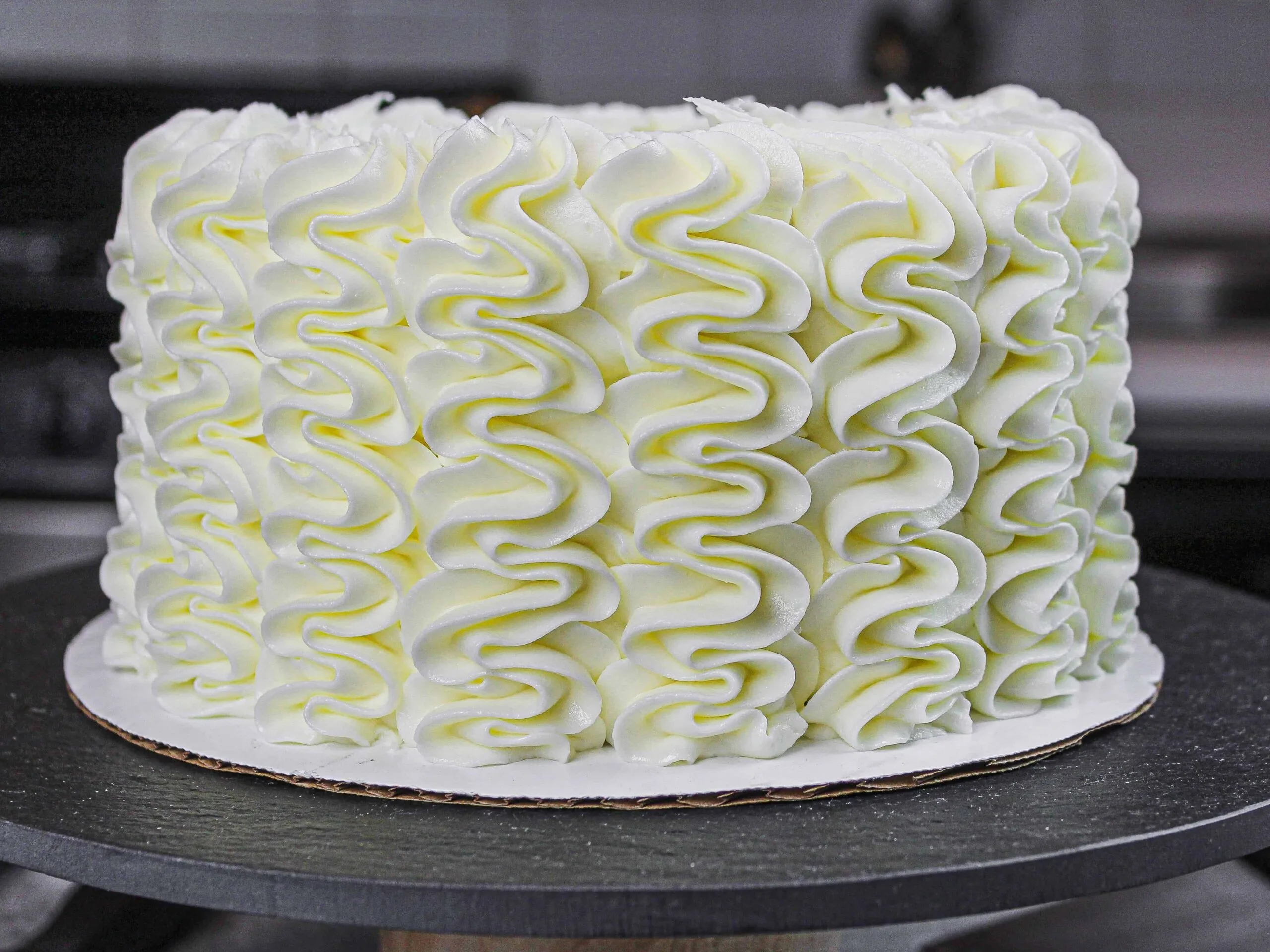 image of gluten free layer cake  frosted with a wilton 1M frosting tip