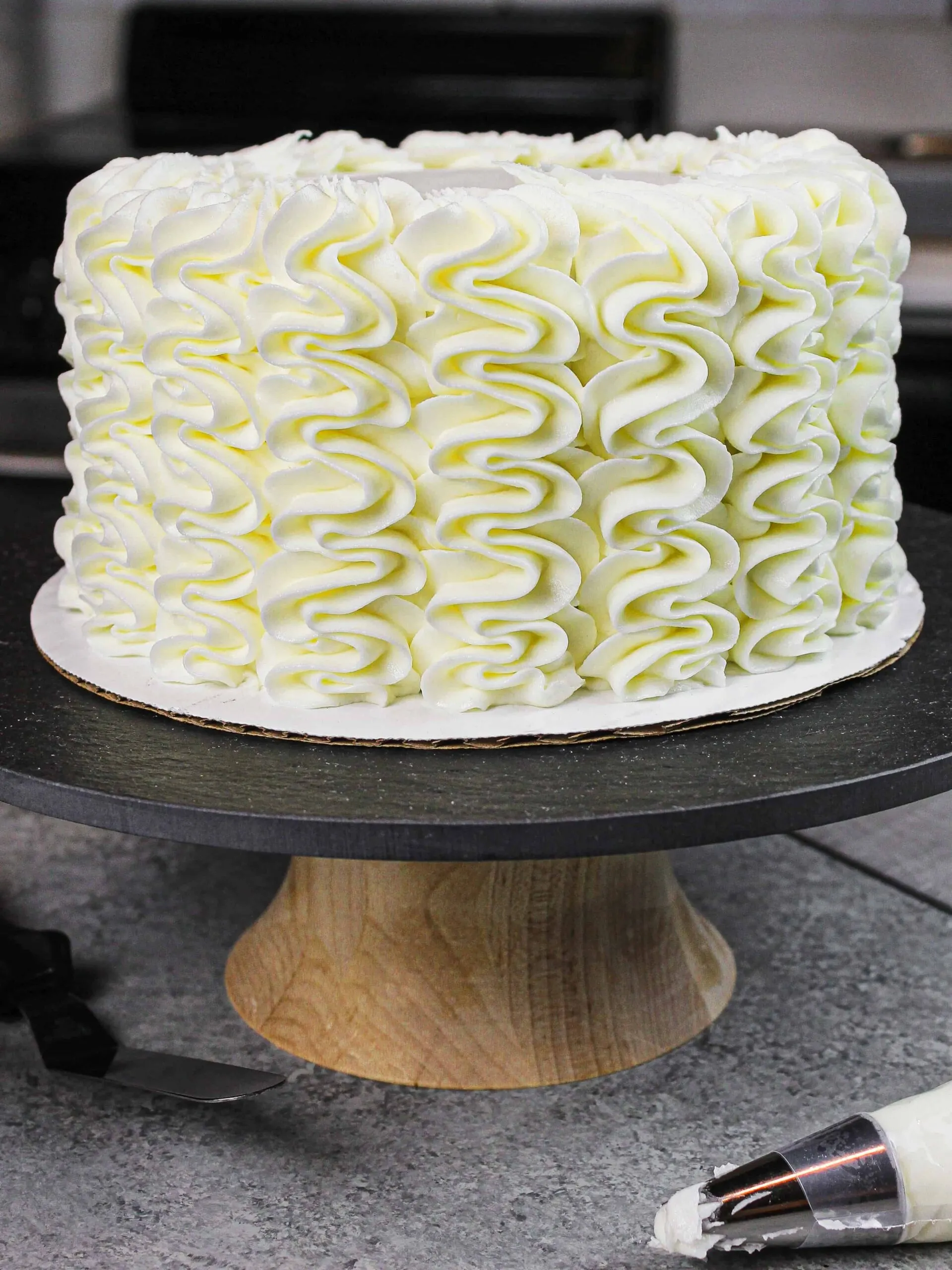 image of easy gluten free cake decorated with gluten free frosting squiggles
