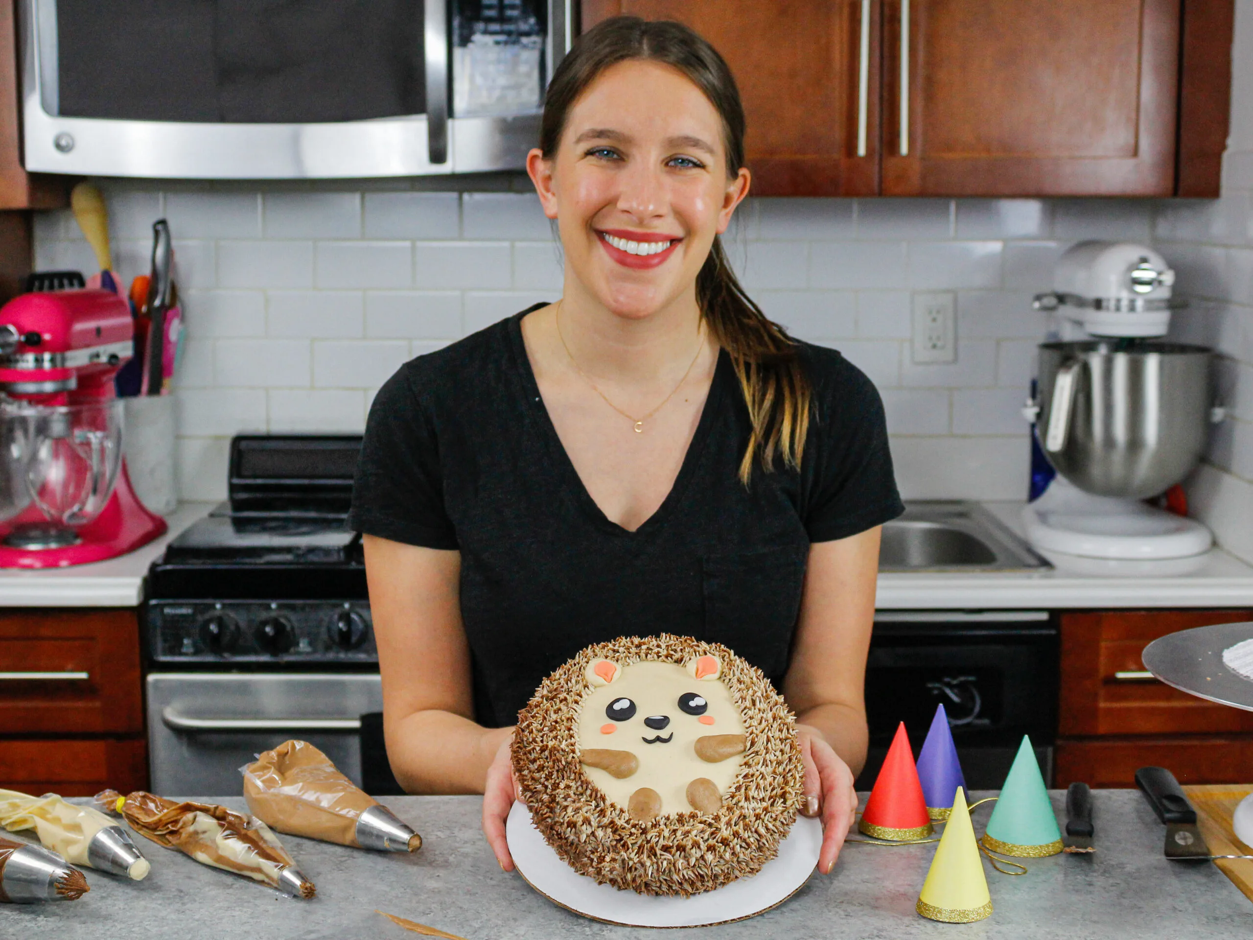 image of chelsey white of chelsweets with an adorable little hedgehog cake she made as part of her animal cake series