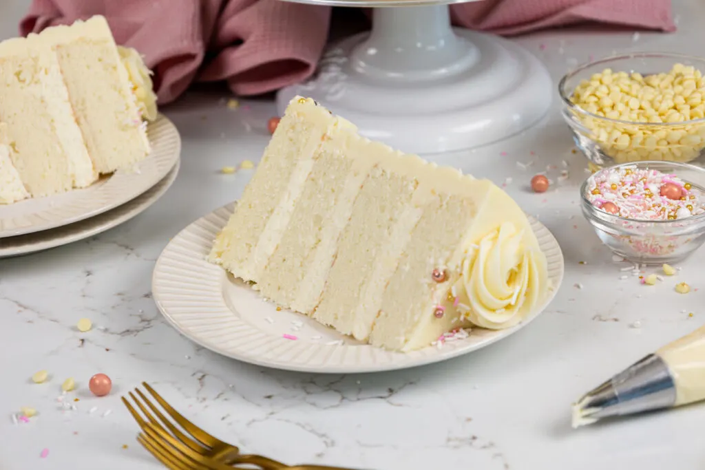image of a vanilla cake that's filled with a white chocolate mousse cake filling