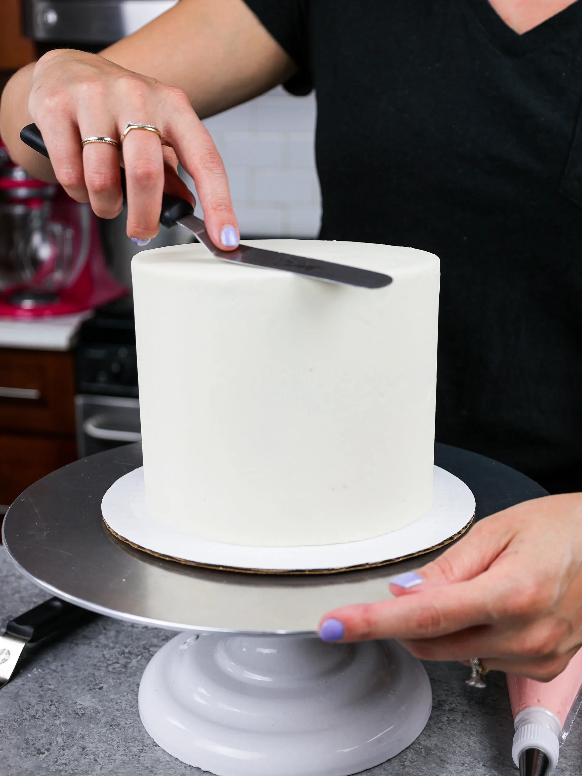 image a 6-inch layer cake that has perfectly smooth buttercream frosting